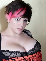 Amateur big boob babe Dors Feline strips naked and plays with her tits